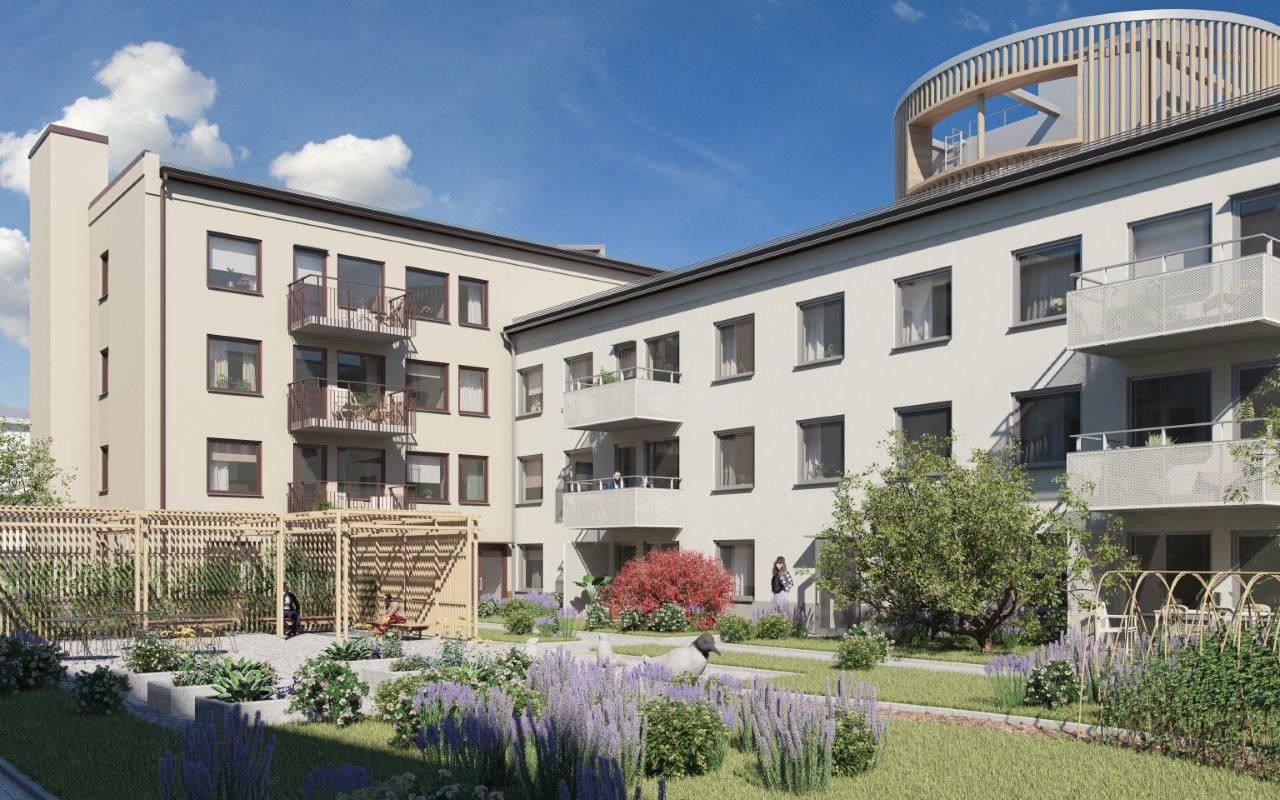 Innergård med två byggnader i vinkel. Här syns odlingar, gräsmatta och träd samt en pergla.